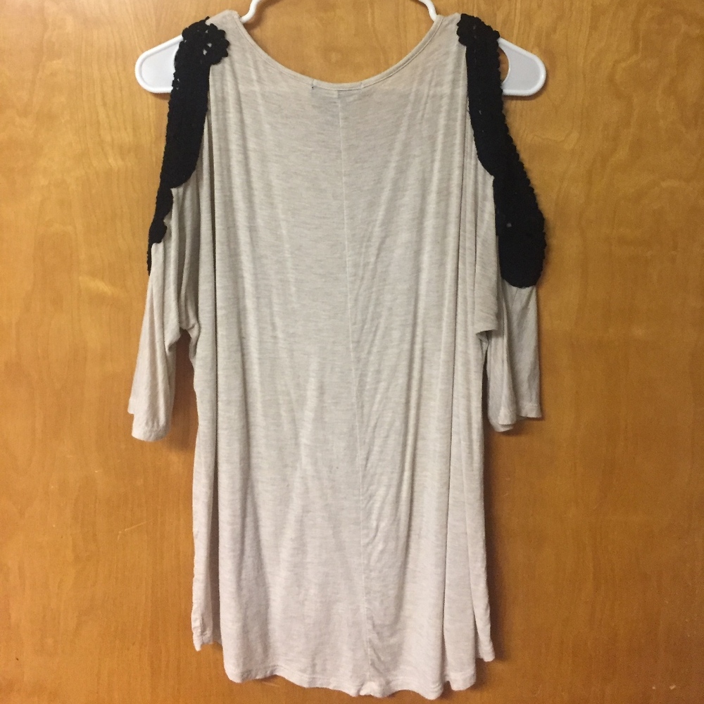 Tan shirt with black shoulder lace